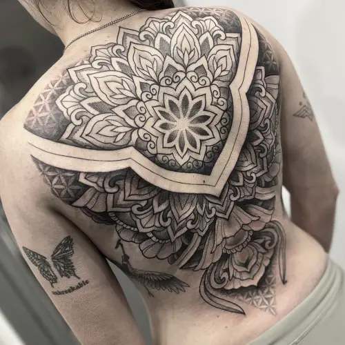 Ornamental back tattoo for women